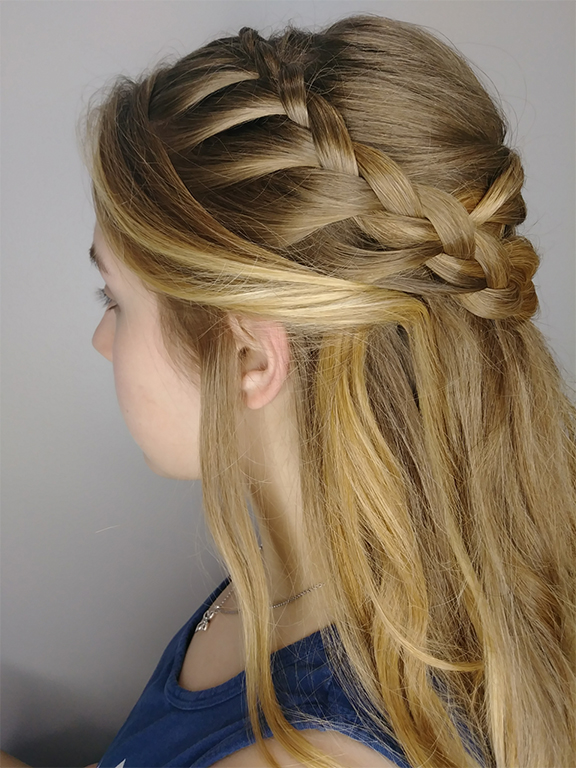 Side profile of a woman with an intricate braided hairstyle. - K. Charles & Co. in San Antonio and Schertz, TX