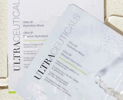 Two Ultraceuticals Ultra B2 Hydration Mask packages, one partially open, on a light surface. - K. Charles & Co. in San Antonio and Schertz, TX